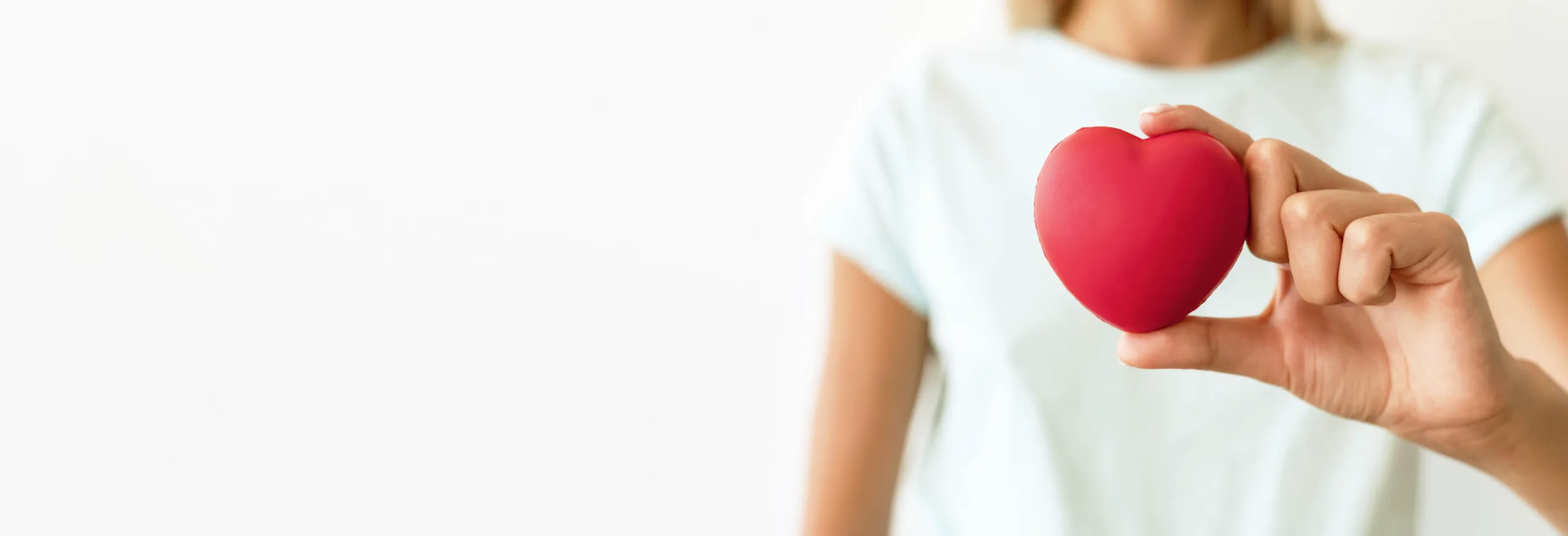 front-view-defocused-woman-holding-heart-shape